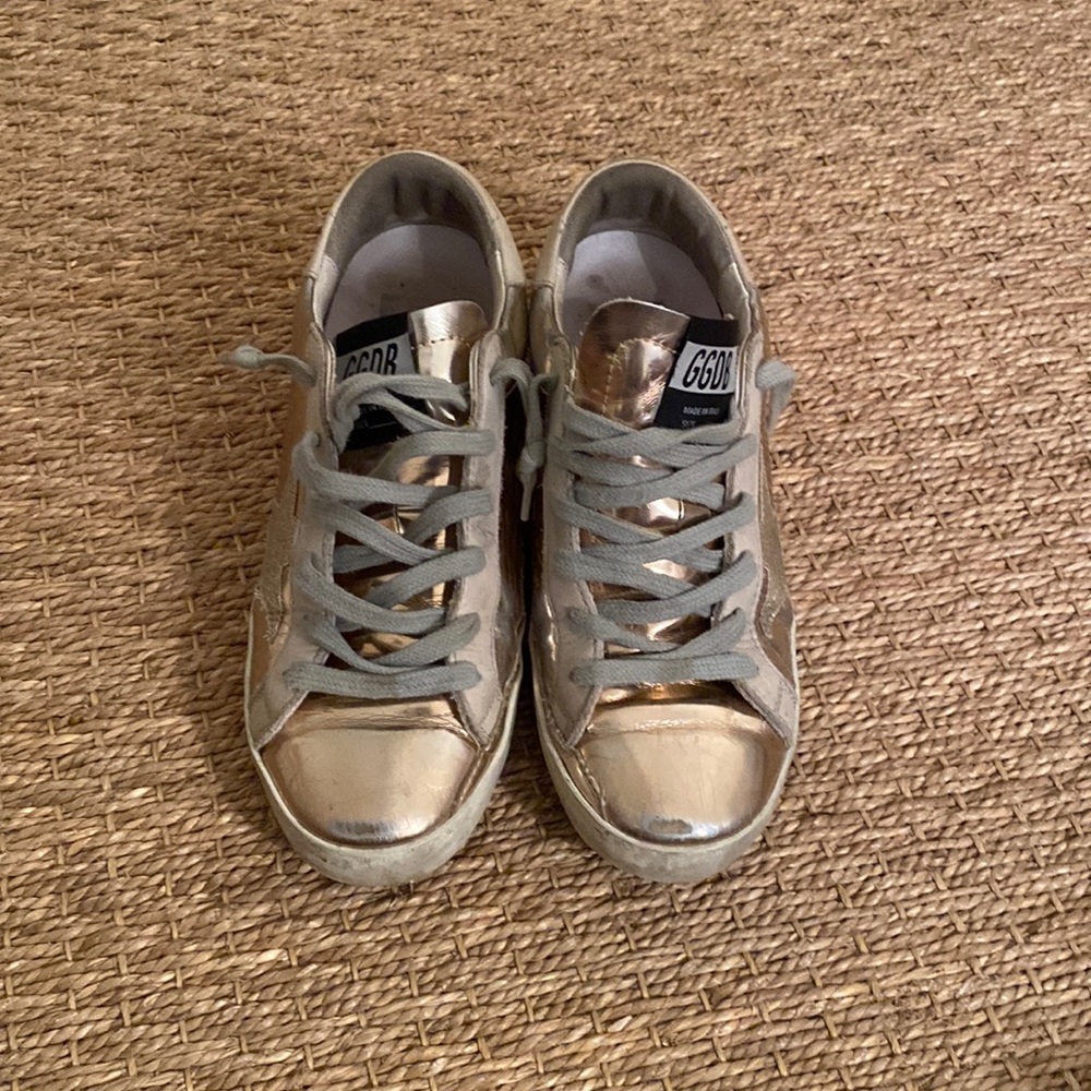 Size 35 rose gold super stars. Worn but good condition